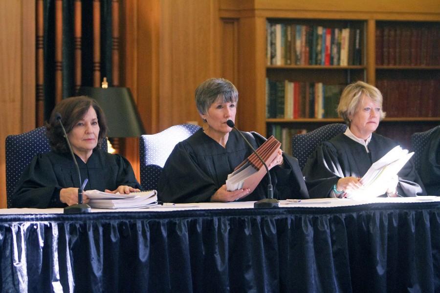 Presiding Judge Sharon Keller (left), Judge Cheryl Johnson and Judge Barbara Hervey address the audience and begin the first oral argument on capital murder. 