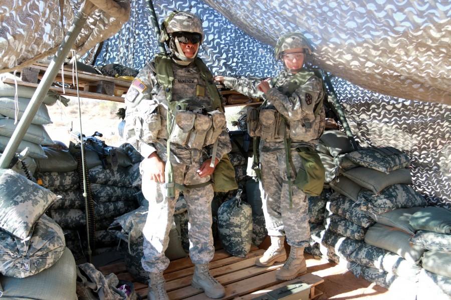 Sergeant Radia McKenzie, financial management specialist and Alena Stepanova, financial management, both with the 4th Financial Management Support Unit, stand at their post during Iron Focus.