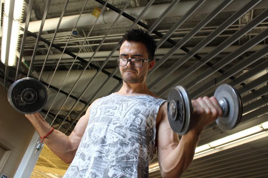 Senior music theory and composition major, Roberto Loya lifts weights at the UTEP recreation center 