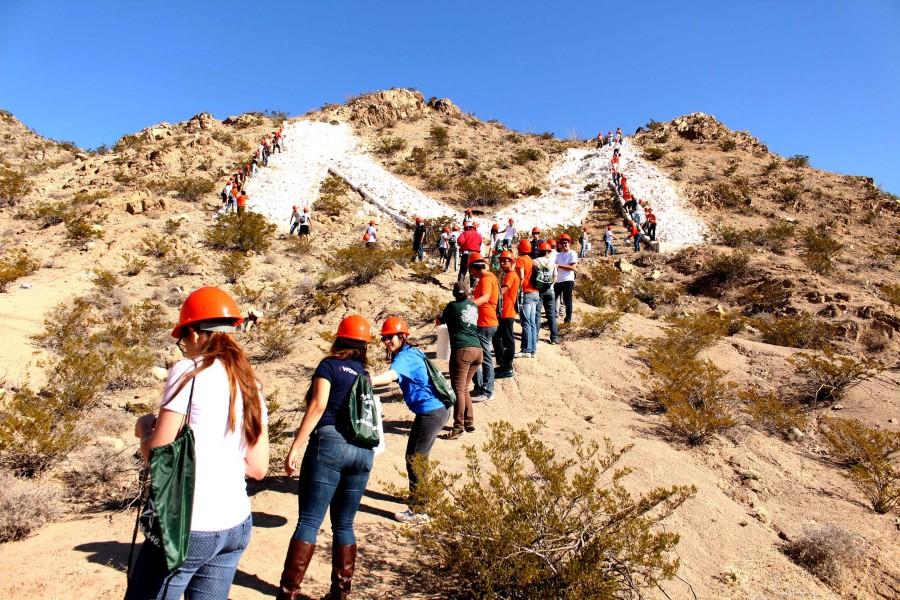 Before the whitewashing commenced UTEP students participating on TCM Day had to climb the hill. 