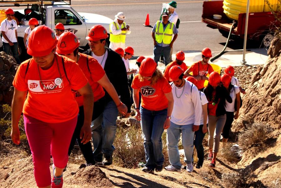 Students climb up to the M next to Sun Bowl Drive. 