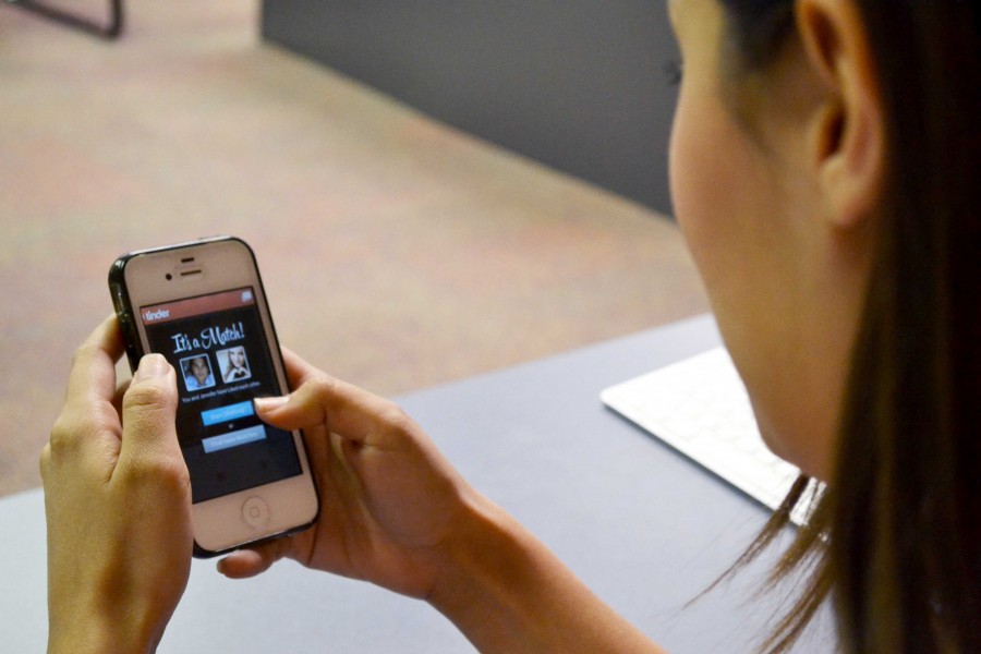 A student uses the app “Tinder” in between classes. 