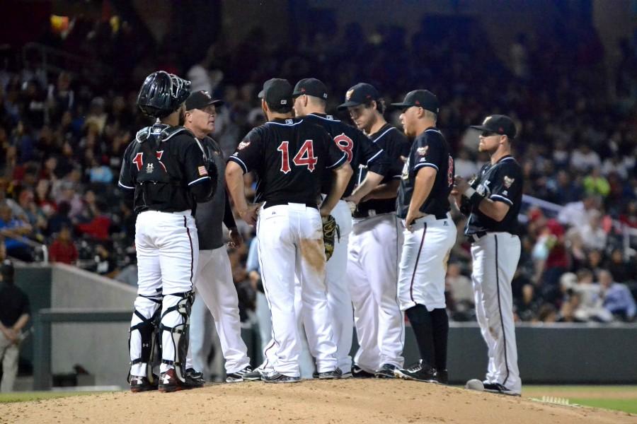 Chihuahuas manager Pat Murphy talks to his players during a trip to the mound.