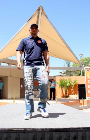 A participant walks the runway. 