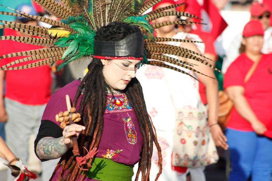 Member of Danza Azteca Omecoatl during the Marcha Campesina.