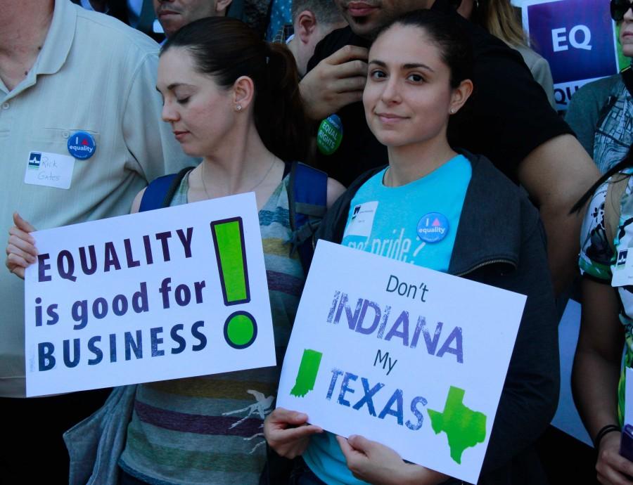 Participants at Freedom Advocacy Day hold posters.