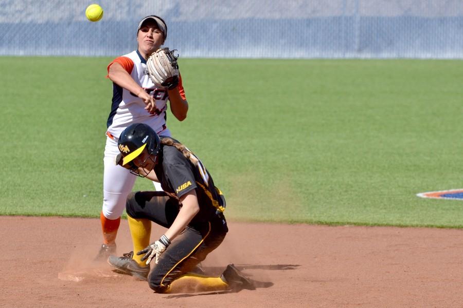 Sophomore Hope Moreno throws towards first base after getting an out at second.