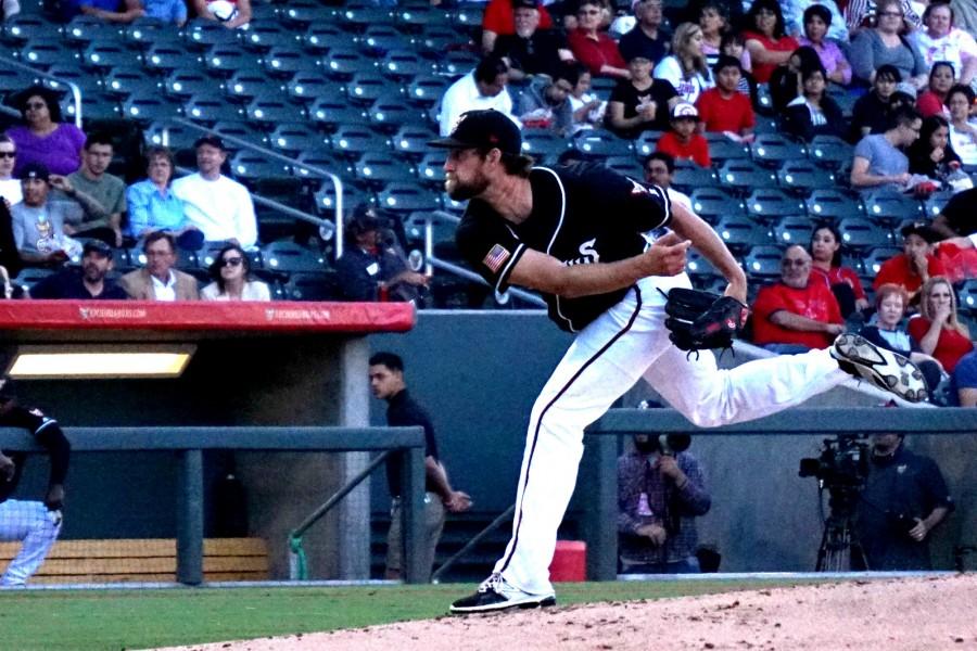 Pitcher Jerry Sullivan lauches a strike