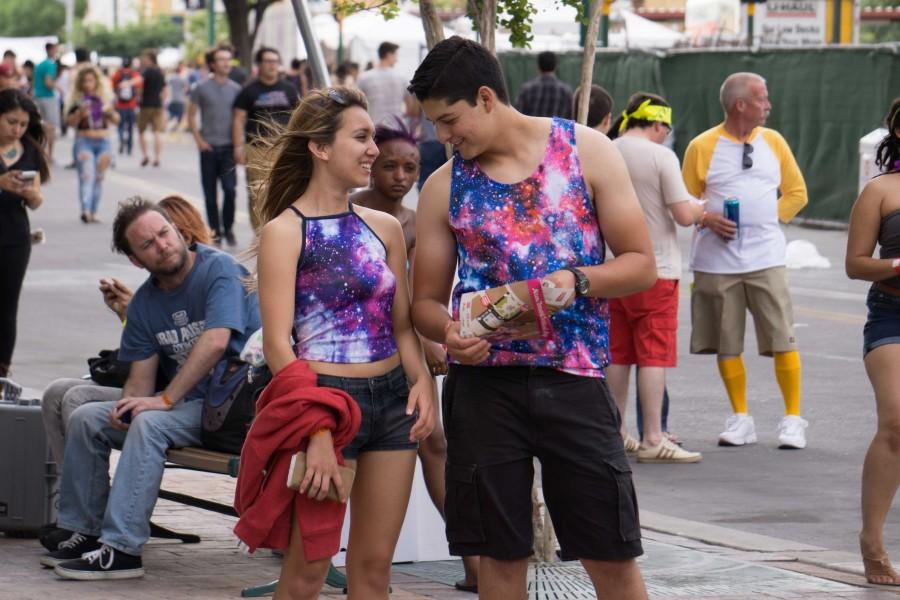 A matching couple shares a laugh white at Neon Desert Music Festival 2015. 