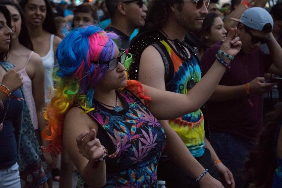 Colorful concert-goer enjoys the music in downtown El Paso.