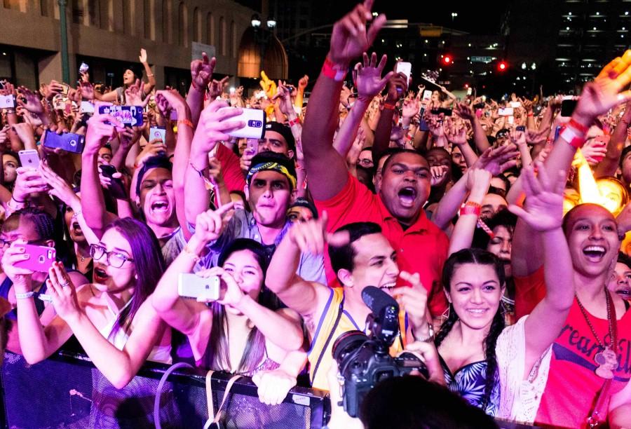 Concert goers watch J Cole perform at Neon Desert Music Festival in 2015.