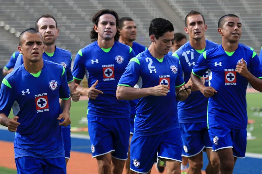 Cruz+Azul+players+warm+up+prior+to+practicing+on+the+field+of+the+Sun+Bowl.+They+will+play+Tijuana+at+the+same+field+on+Wednesday%2C+July+8th.