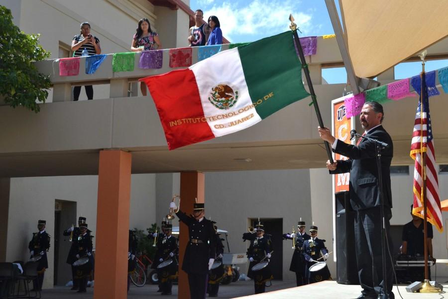 Consul General of Mexico in El Paso Jacob Prado waves the Mexican flag after performing El Grito