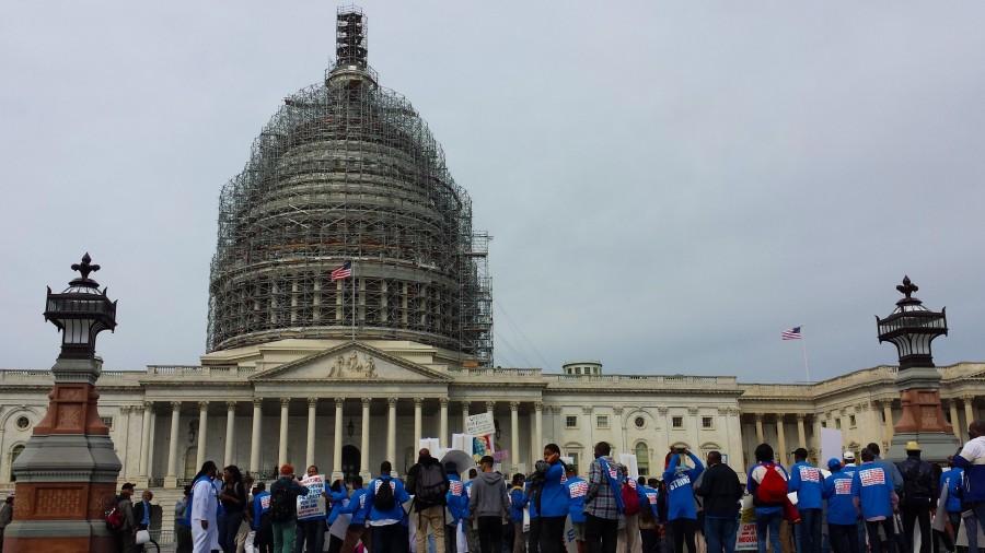 Advocates sing, “Don’t worry about a thing, cause every little thing is gonna be all right,” from Bob Marley’s song “Three Little Birds.” They marched to the Capitol on Tuesday to advocate for better benefits for low-wage workers. Photo courtesy of SHFWire.