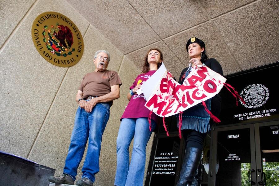 The leaders of the march hold a speech after speaking with officials at the Mexican General Consulate office .