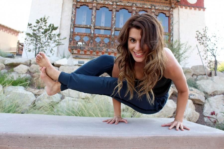 Education graduate student, Rasmiyeh Asam demonstrates one of the yoga poses she teaches. 