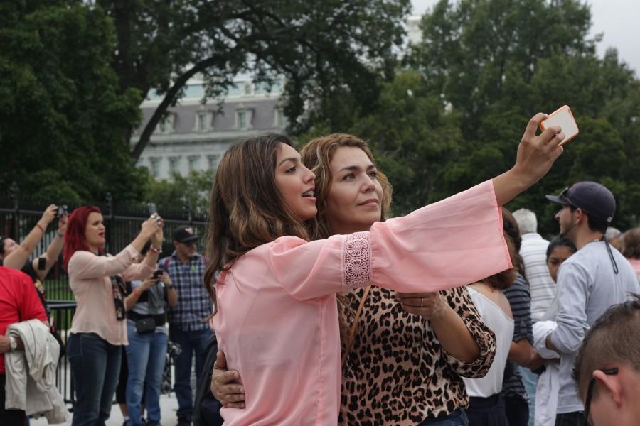 amanda guillen/ SHFWIRE
Crystal Zapata, 19, takes a selfie Tuesday with her mother, Lourdes Zapata, 39, in front of the White House