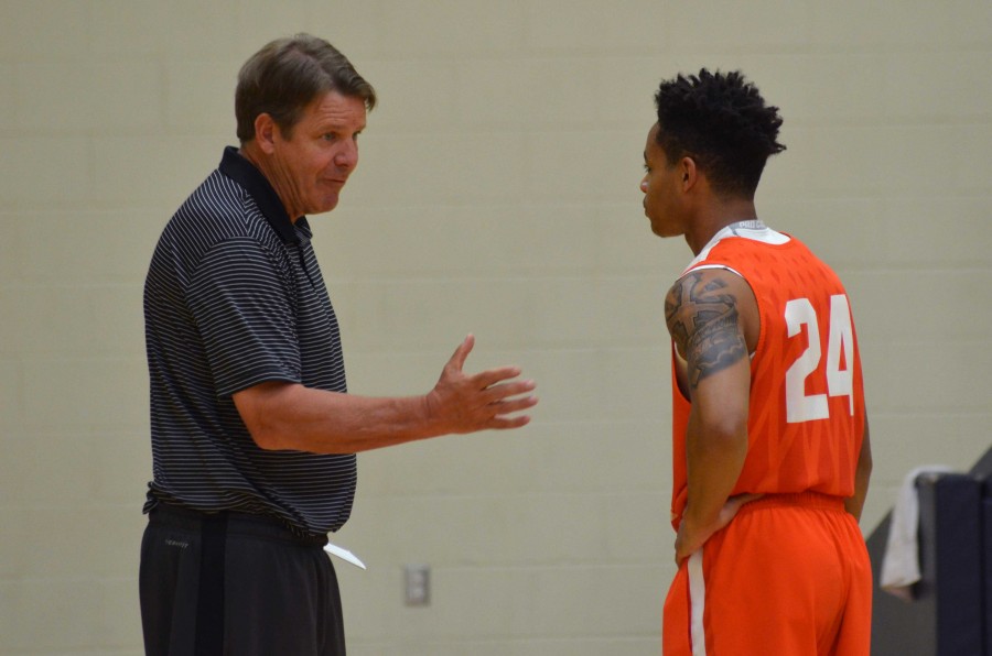 UTEP men’s basketball head coach Tim Floyd instructs freshman guard Tedric Johnson during a Monday practice.