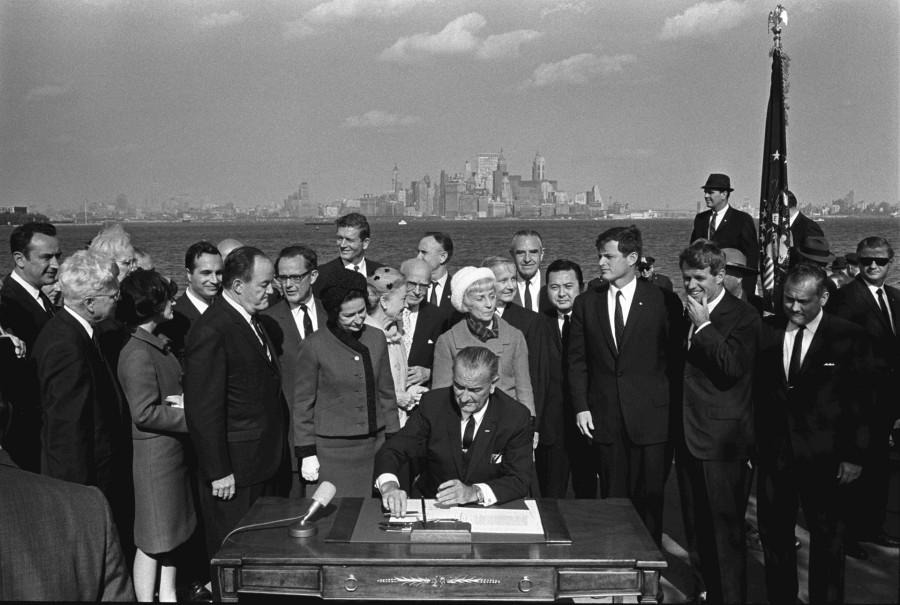 President Lyndon B. Johnson signs the Immigration and Nationality Act of 1965 on Oct. 3, 1965. This act abolished the national quota system and changed the demographic makeup of the United States. 