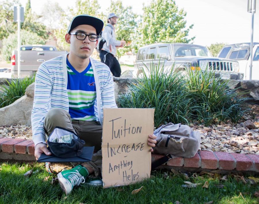 Freshman philosophy major Jorge Martinez poses as a student struggling from tuition increase. 