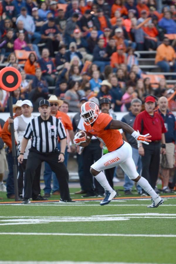 Junior wide receiver Jaquan White runs towards the end zone after a quick catch.