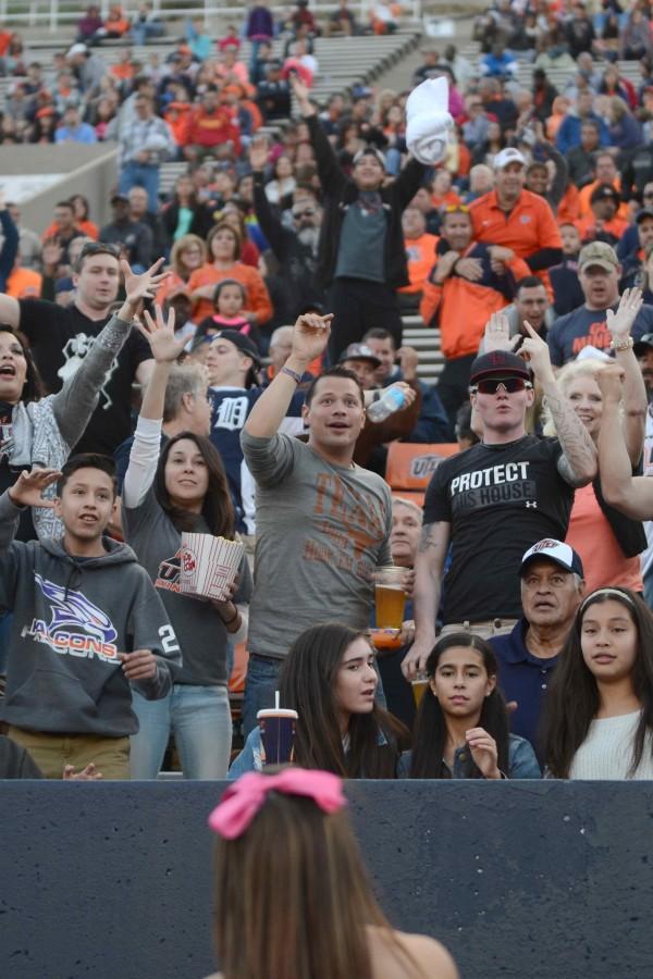 UTEP Miner fans react as a free shirt is throw at them. 