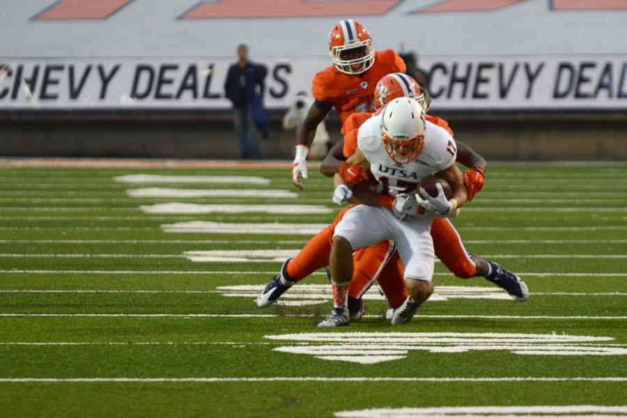 UTEP players take down a UTSA wide receiver. 