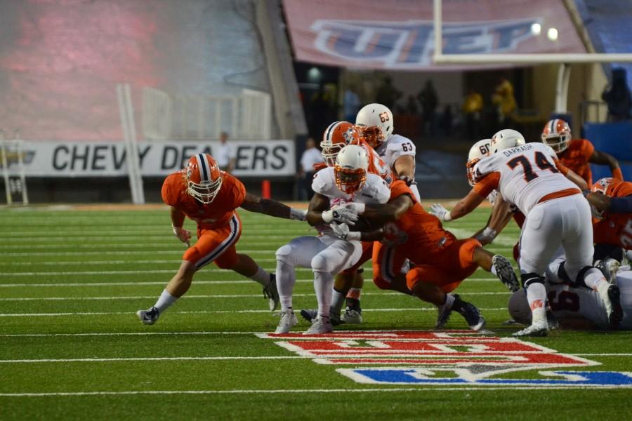 The UTSA running back is taken down by UTEP players.