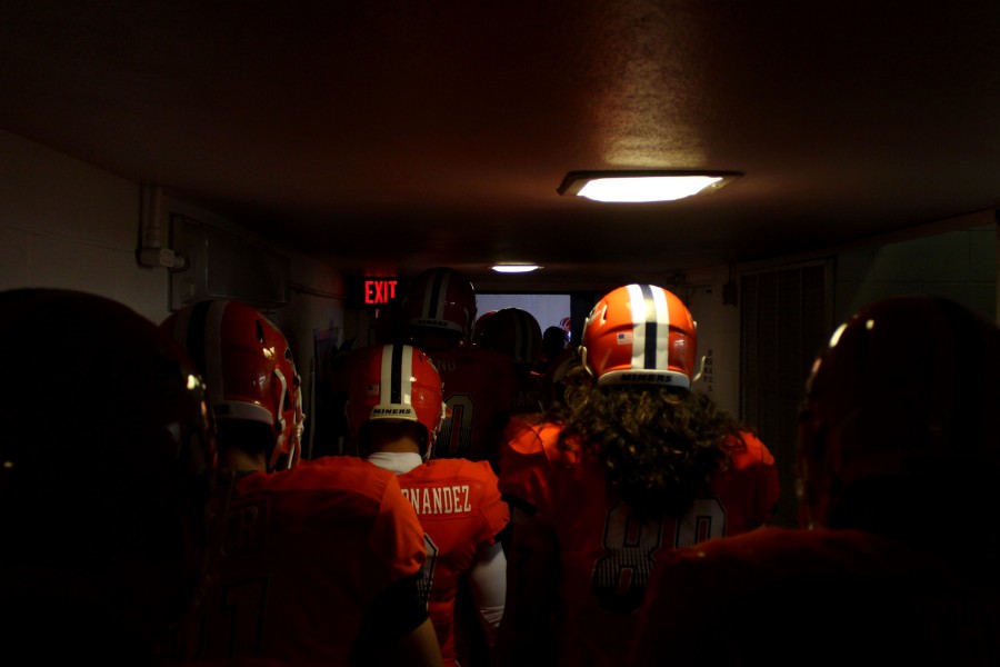 The UTEP Miners leave the locker room to the filed. 