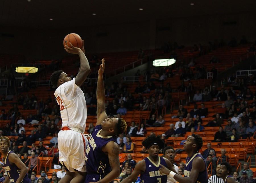 UTEP Forward Terry Winn jumps to shoot the ball over an Acorn defender. 