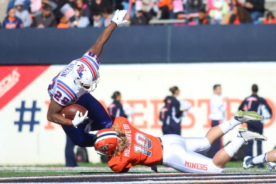 Senior linebacker Jimmy Musgrave tackles Louisiana Tech running back Kenneth Dixon. 