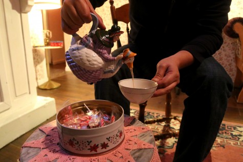 A customer pours out an Elder Punch from a vintage teapot. 