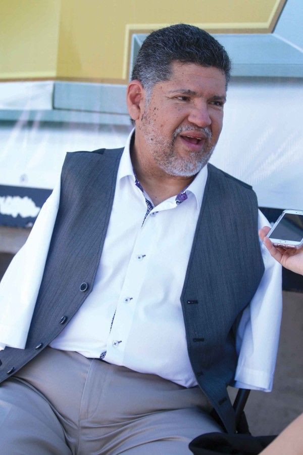 Tony Melendez is interviewed before his performance at the Sun Bowl during “Two Nations, One Faith.” 