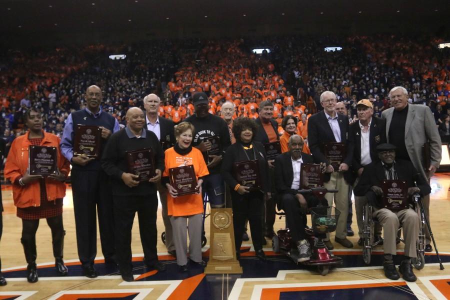 Members of the 1966 basketball team and family members gather at the Don Haskins Center. 