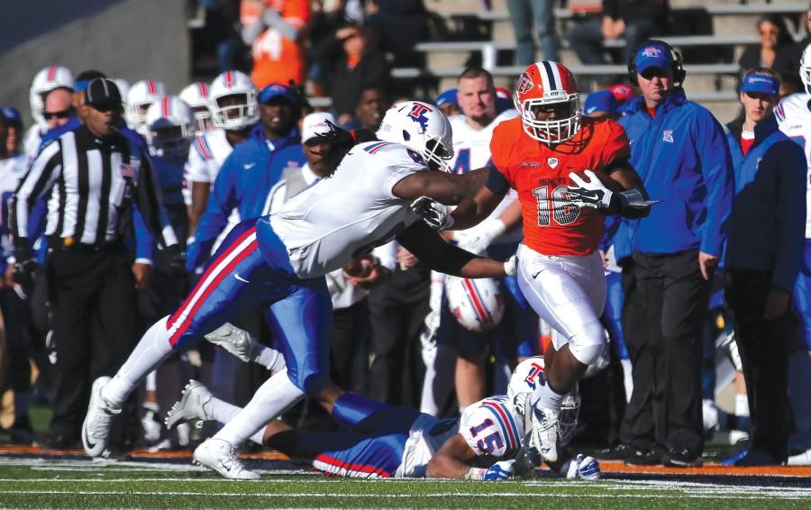 Running back TK Powell evades a Louisinana Tech defender. Powell rushed for 150-yards against the Bulldogs. 