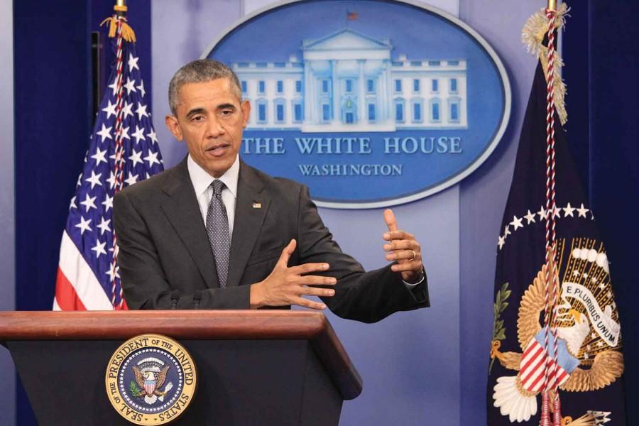 President Barack Obama urges Congress to close corporation tax loopholes during a press briefing Tuesday at the White House. Obama says tax inversions make it harder to keep the economy strong.