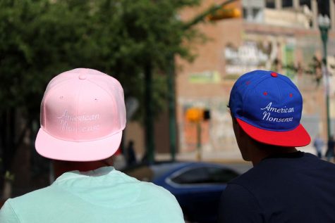 Mike (left) wears the pink American Nonsense hat, which they had made to raise awareness on breast cancer. 