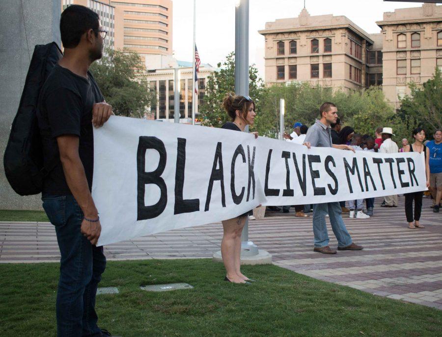 Citizens of El Paso hold up a Black Lives Matter banner   at San Jacinto Plaza. 