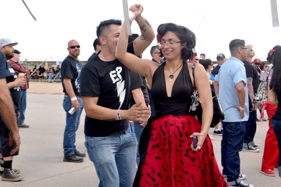 Two festival goers swing to The Paladin. The band plays a country swing that allows dancers to triple step.