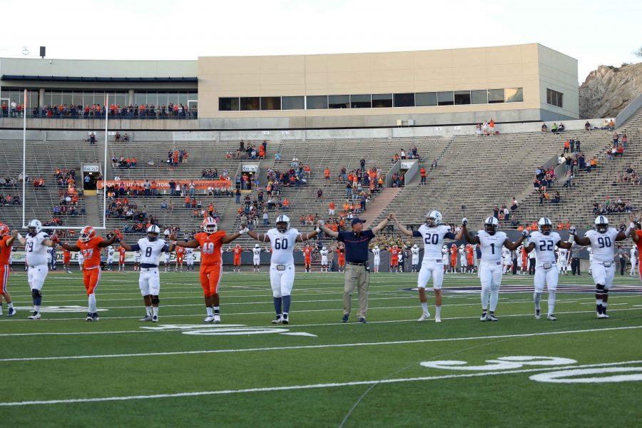 The+UTEP+football+team+joins+Old+Dominion+players+in+a+circle+of+unity+prior+to+kick+off+on+Saturday+Oct.+29+