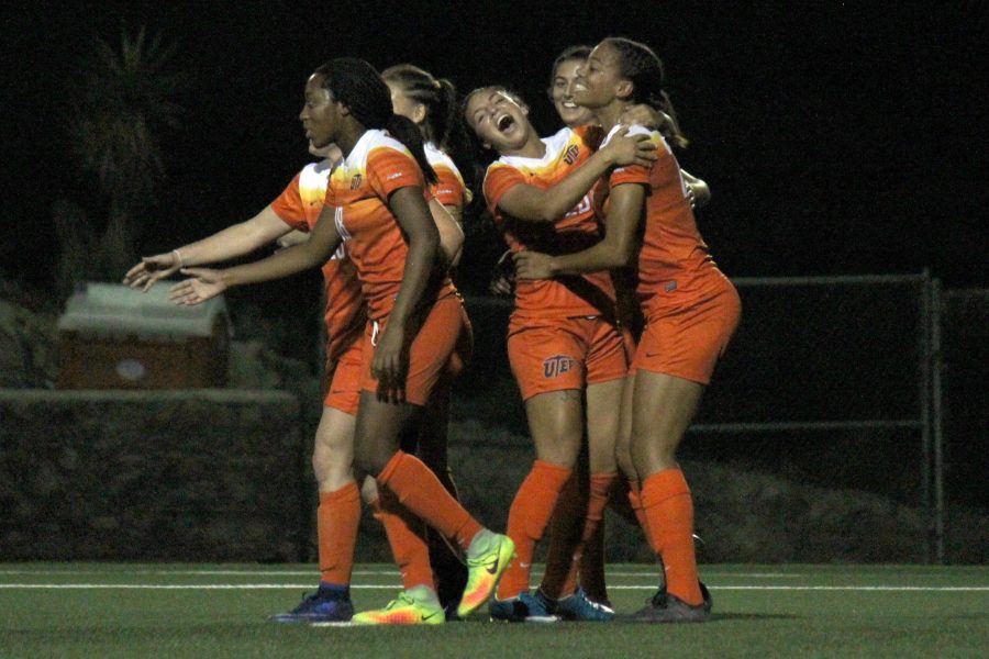 Miners celebrate their victory against Southern Miss 5-0