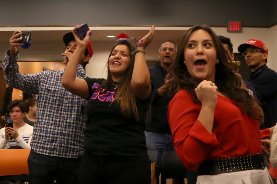 Members of the UTEP College Republicans cheer after hearing CNN projections of Trump ahead in the polls. 