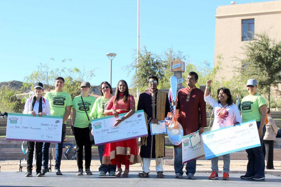 First, second and third place winners of the food fair Indian Student Association, Bangladeshi Student Association and Arab Student Association hold the prize money they won for student organizations. 