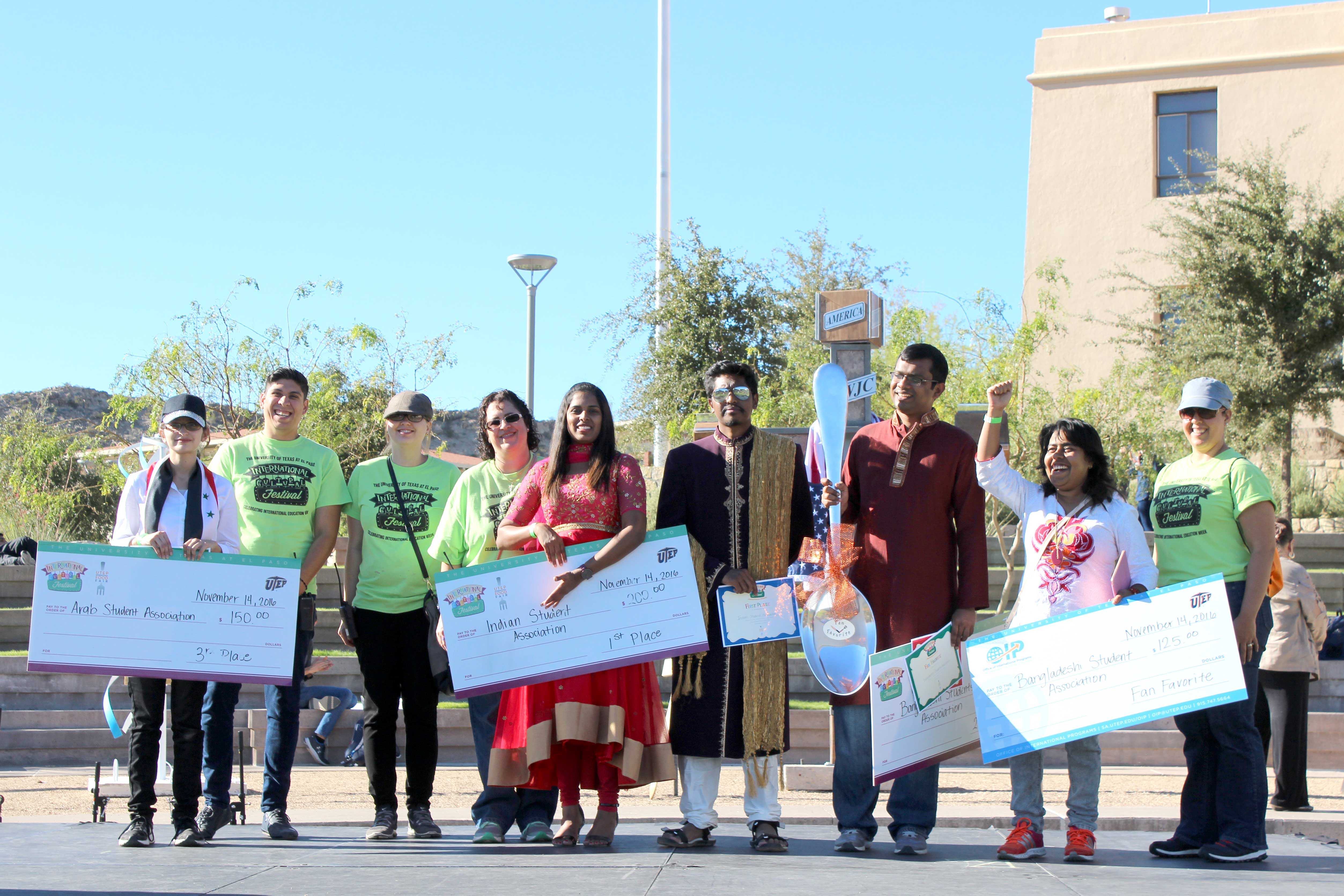 First, second and third place winners of the food fair Indian Student Association, Bangladeshi Student Association and Arab Student Association hold the prize money they won for student organizations.