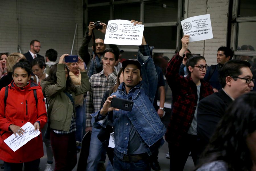 (Left) Picketers hold up signs outside of the vacant fire station where the city held a community meeting for Union Plaza neighborhood residents. (Right) Protestors in opposition of the arena question Representative Cortney Niland on its location. 