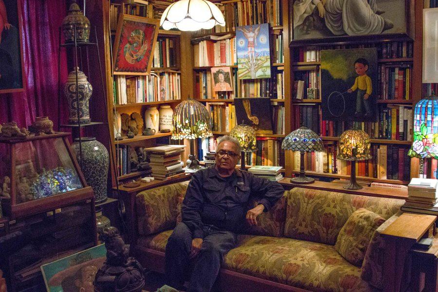 Juan Sandoval surrounded by his collection at his apartment.