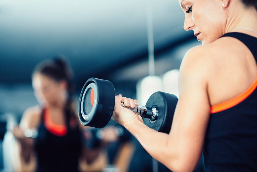 Gym Exercising - Female athlete in gym working with weights in front of mirror
** Note: Visible grain at 100%, best at smaller sizes