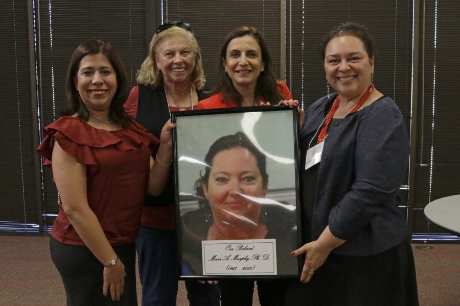(Left to right) Areli Chacon Silvia, Malu Picard-Ami, Maissa Kharib, Gina Nunez-Mchiri pose together in remembrance of Moria A Murphy.