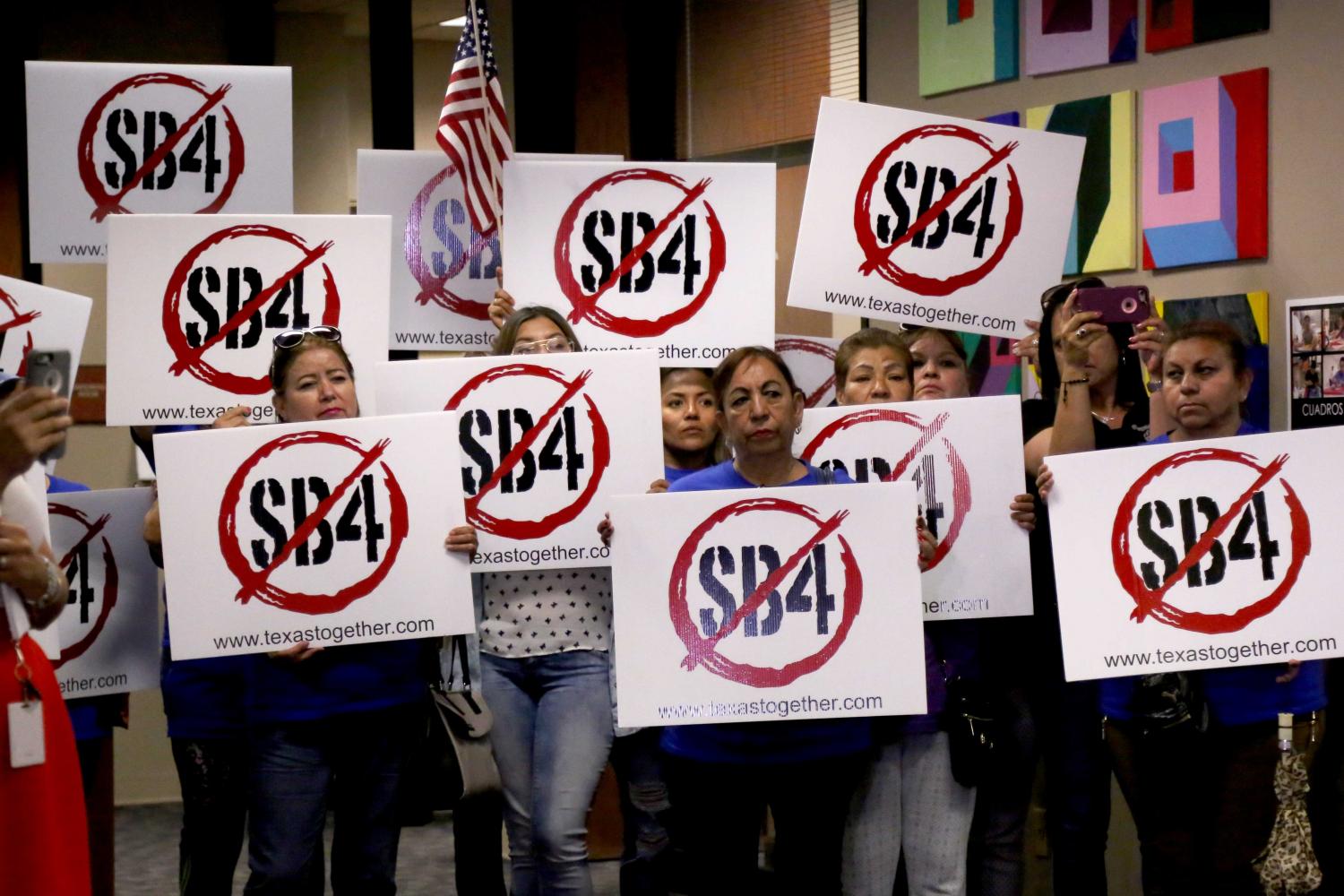 Demonstrators show their support for the Anti-SB4 civil suit.