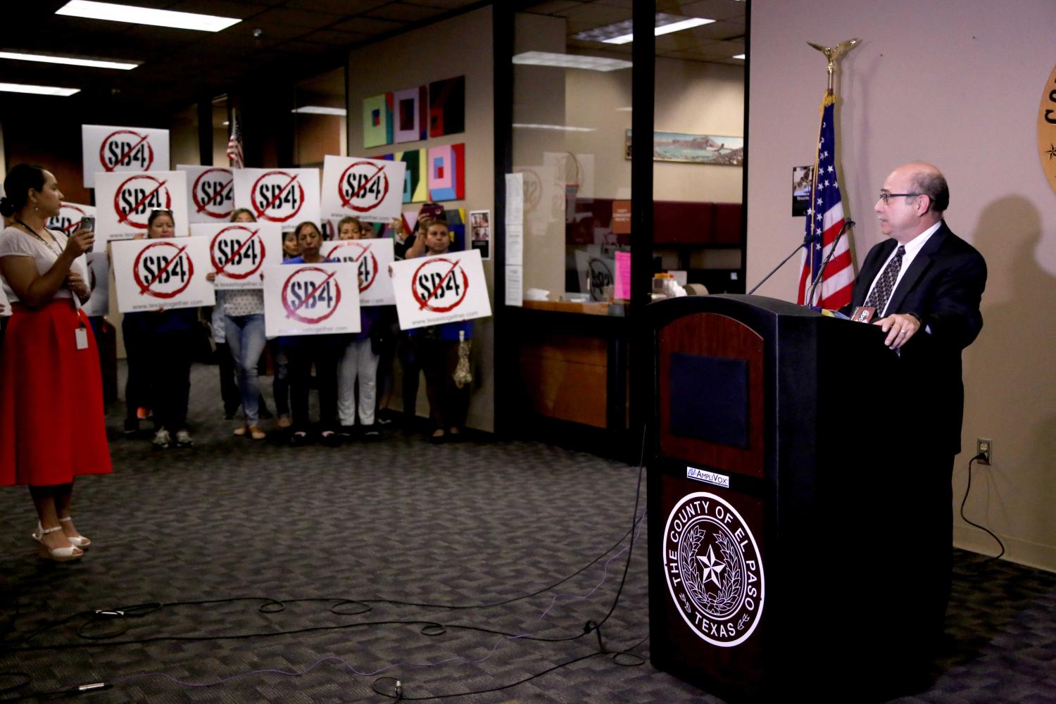 Demonstrators show their support for the Anti-SB4 civil suit.